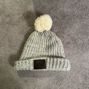 Gray Pom Pom knitted hat with AXO logo